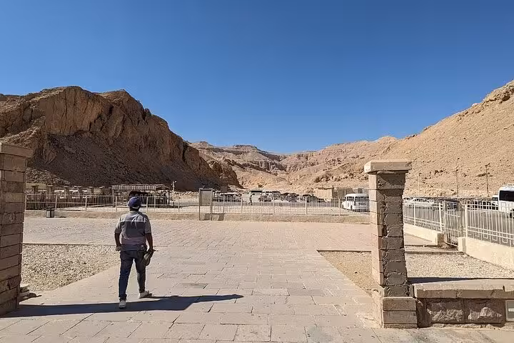 Tourist exploring the entrance of the Valley of the Kings on a private day tour of Luxor West Bank.