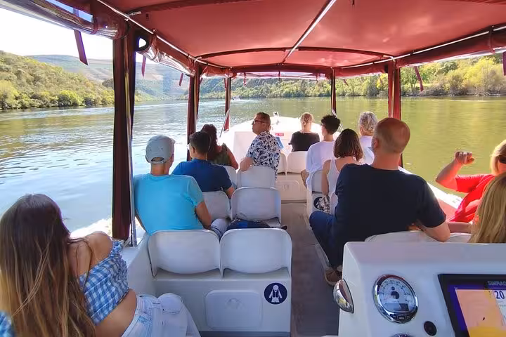 Inside view of a private Douro River boat tour, 1-hour guided cruise through vineyards with Port wine included