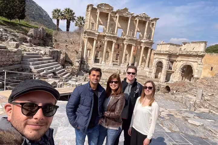 Group enjoying a skip-the-line private tour at the ancient ruins of Ephesus with the iconic Library of Celsus in view.