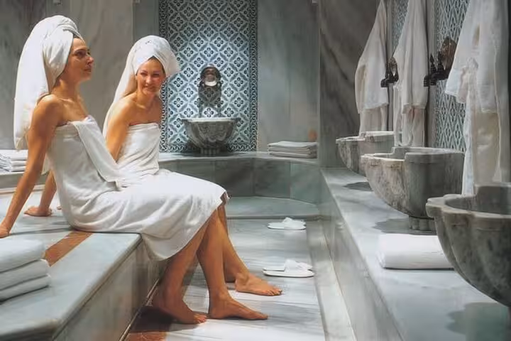Guests relaxing in a traditional Turkish hammam steam room on a private Ephesus tour from cruise port
