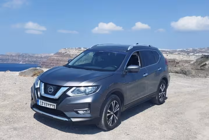 Executive chauffeur-driven SUV in Santorini near the caldera, reliable private transfer for tours and hotels