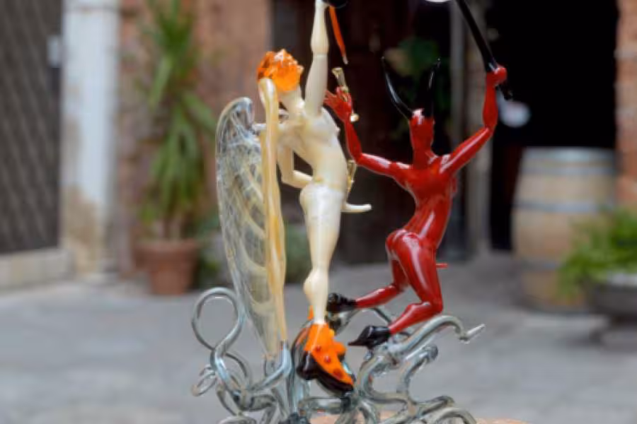 Exquisite glass sculpture of angel and devil crafted during private glassmaking lesson with master artisan.