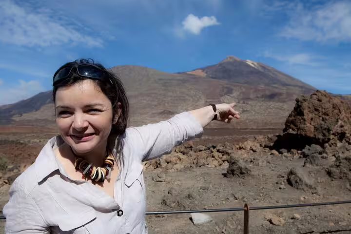 Visitor enjoys breathtaking view of Mount Teide in Teide National Park during private guided excursion.