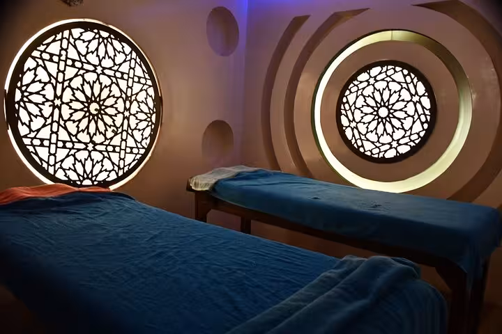 Private hammam spa room in Sharm El Sheikh with massage beds and Moroccan-style backlit windows