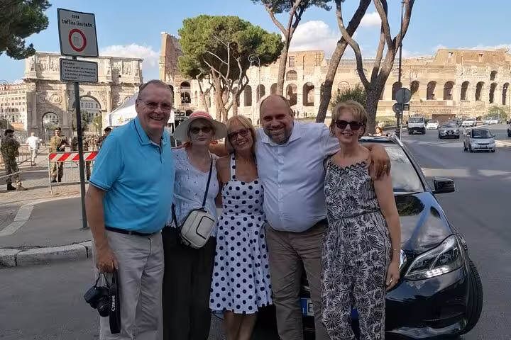 Group photo with private tour car, perfect for Loch Ness Legends and Highland Capital day trip from Inverness