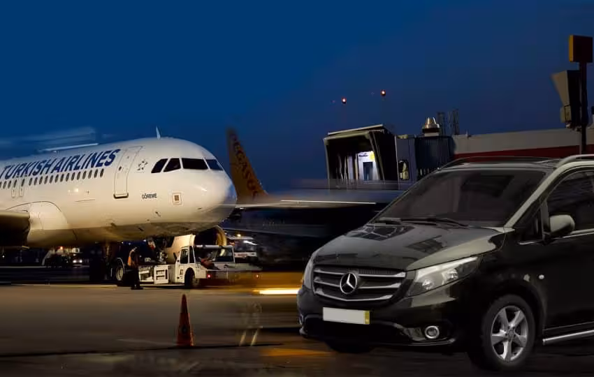 Private Hurghada Airport transfer with Mercedes van pickup beside airplane at night for hotel drop-off
