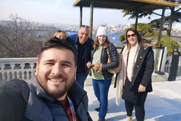 Private Istanbul tour group selfie at a Bosphorus viewpoint near Topkapi Palace gardens