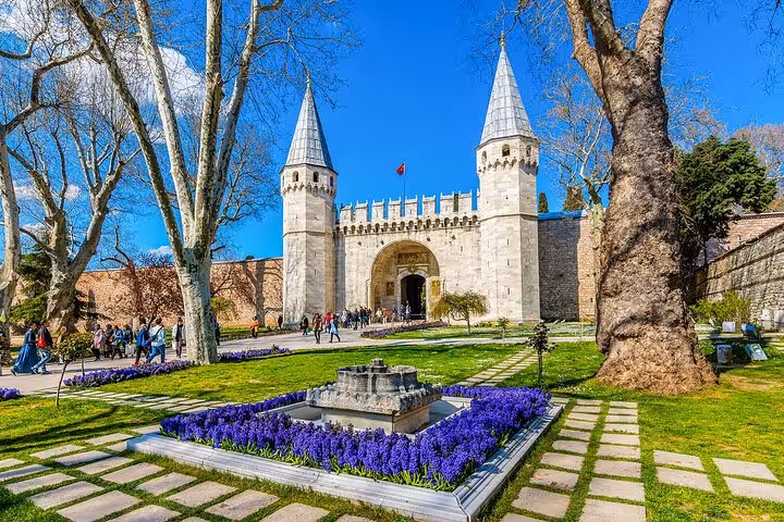 Private car tour to Topkapi Palace Gate in Istanbul, with gardens, flowers and historic towers