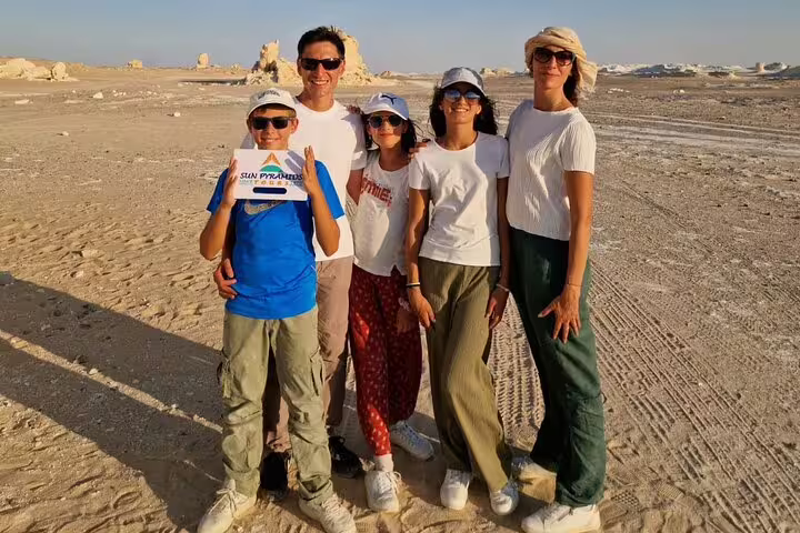 Family photo stop on a private 2-day Jeep safari in the White Desert, Bahariya Oasis, with desert rock formations