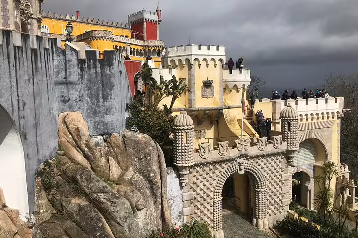 Explore the vibrant and historical architecture of Sintra's Pena Palace on a private jeep tour.