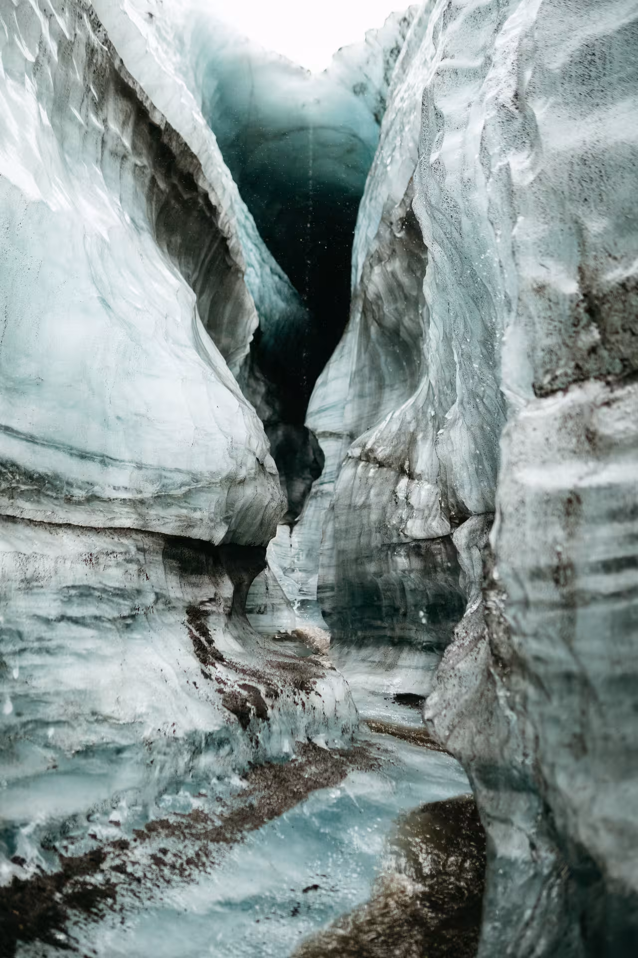 Narrow blue ice canyon and crevasse on Kötlujökull, explored on a private Katla ice cave tour
