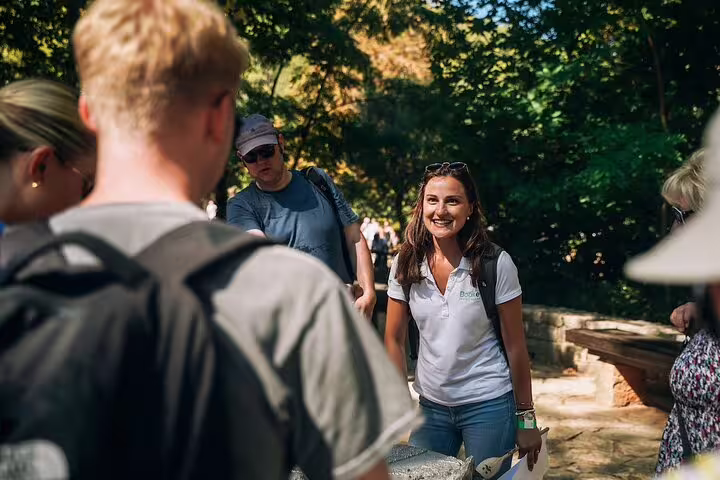 Tour guide briefing guests on a shaded trail during a private Krka Waterfalls tour, Croatia nature walk