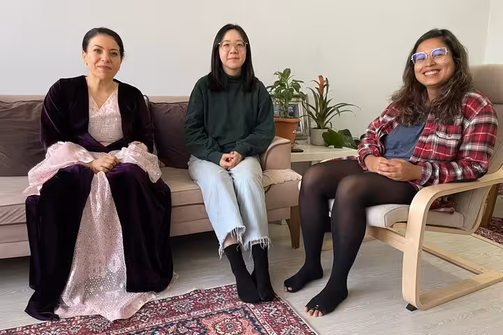 Guests seated with host for a private Kurdish music session in Istanbul, featuring ancient Dengbeji songs