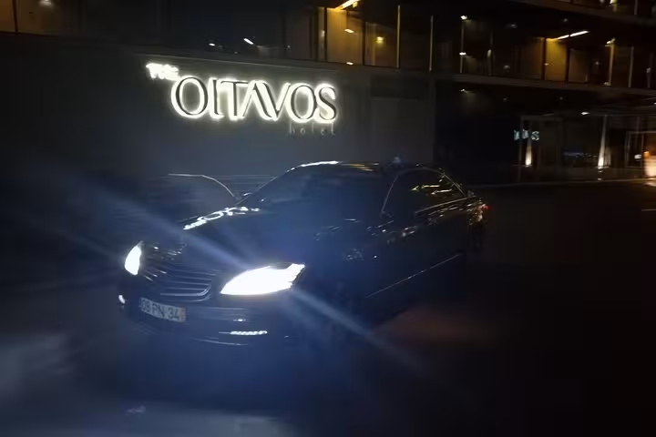 Private Lisbon airport shuttle sedan at night, reliable transfer from Lisbon Airport to city hotel