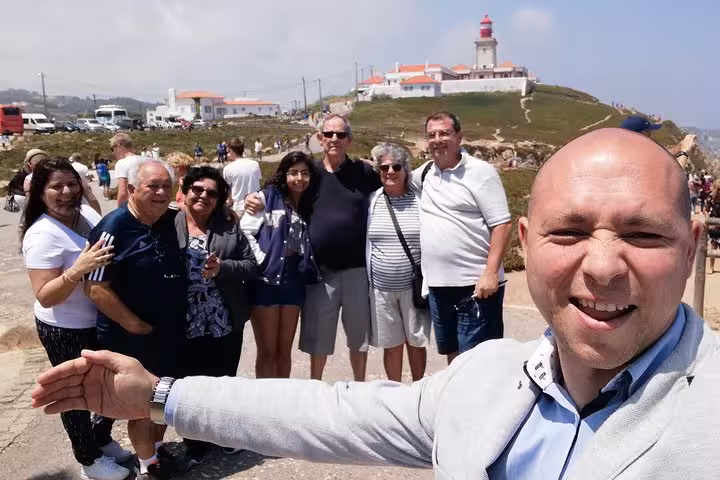 Private Lisbon airport shuttle driver with travelers, convenient door-to-door transfer from Lisbon Airport