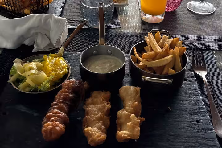 Enjoy a delicious seafood platter with fries and salad on a private Mahe island culinary tour experience.