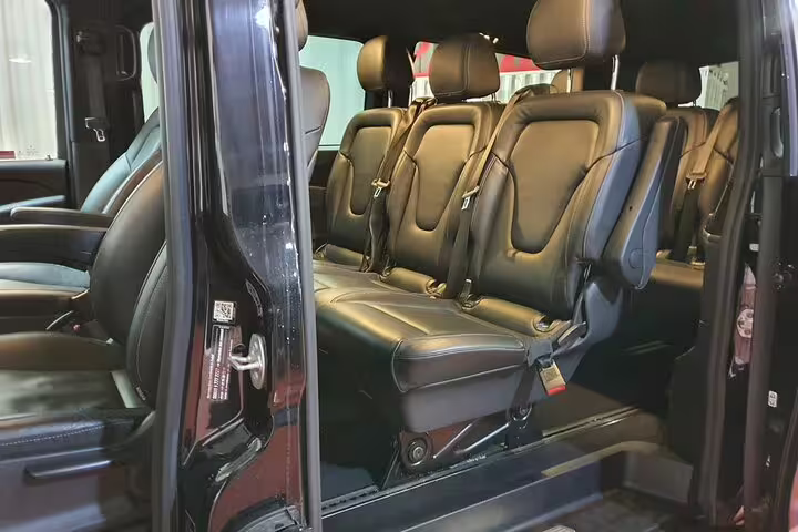 Comfortable leather seats inside private minivan for Avila and Segovia day tour from Madrid with hotel pickup
