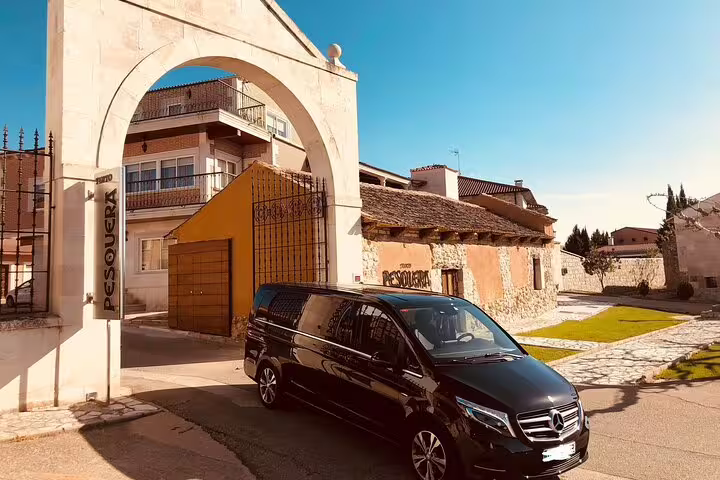Private minivan transfer to Ribera del Duero stopping in Peñafiel village, comfortable door-to-door ride