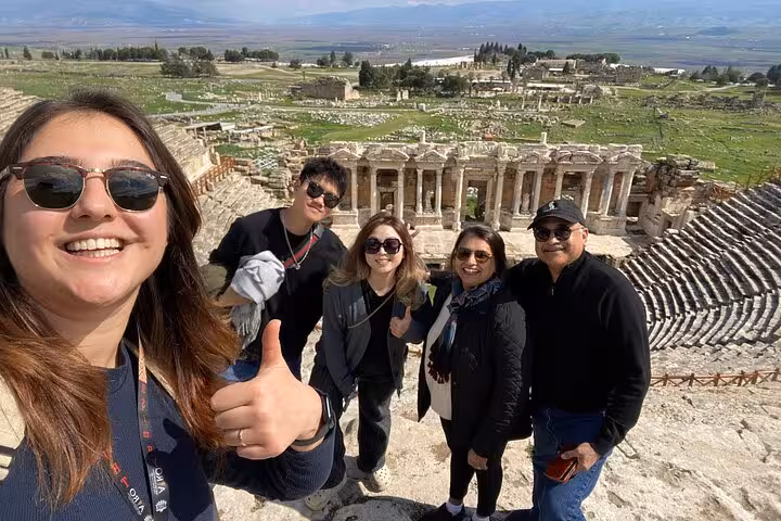 Happy travelers at Hierapolis ancient theater on a private Pamukkale tour from Kusadasi or Selcuk