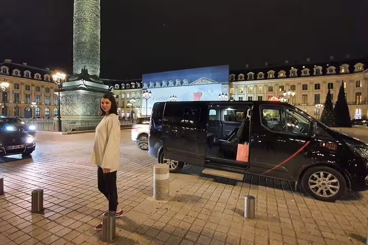 Chauffeured private Paris night tour van at Place Vendôme, evening city sightseeing with hotel pickup