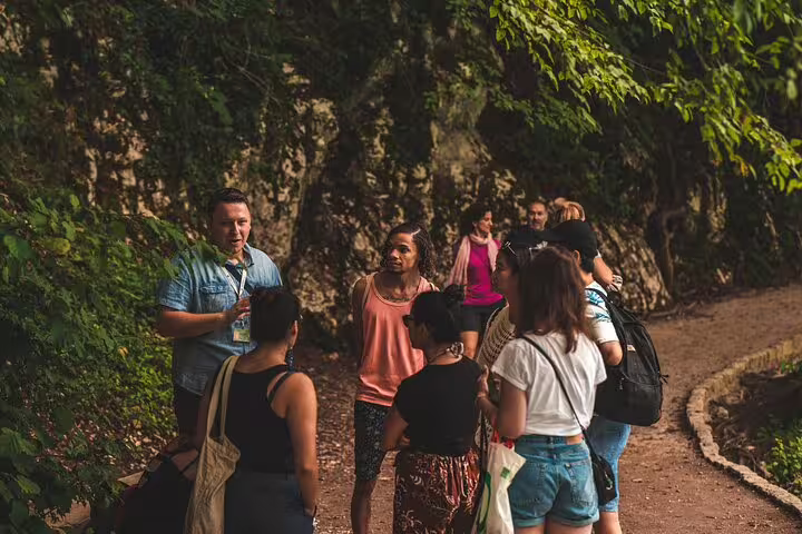 Private Plitvice Lakes tour guide briefing a small group on a shaded forest trail in the national park