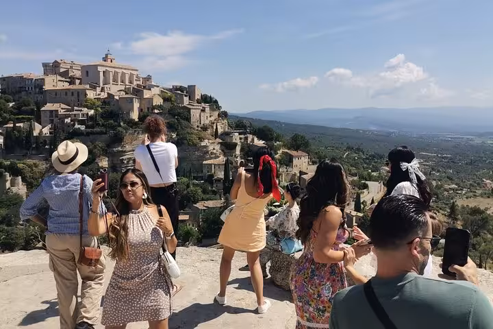 Travelers enjoy panoramic views of Gordes on a private Provence tour with vehicle and driver service
