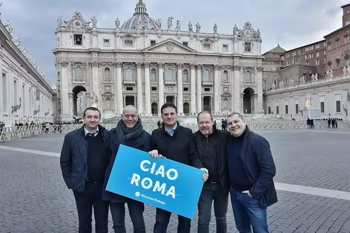 Private half-day Rome sightseeing tour photo at St Peter’s Basilica, Vatican City, holding Ciao Roma sign