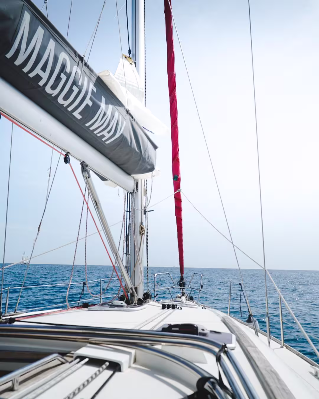 Experience a private 3-hour sailing adventure in Barcelona aboard a sleek yacht, cruising the Mediterranean under clear blue skies.