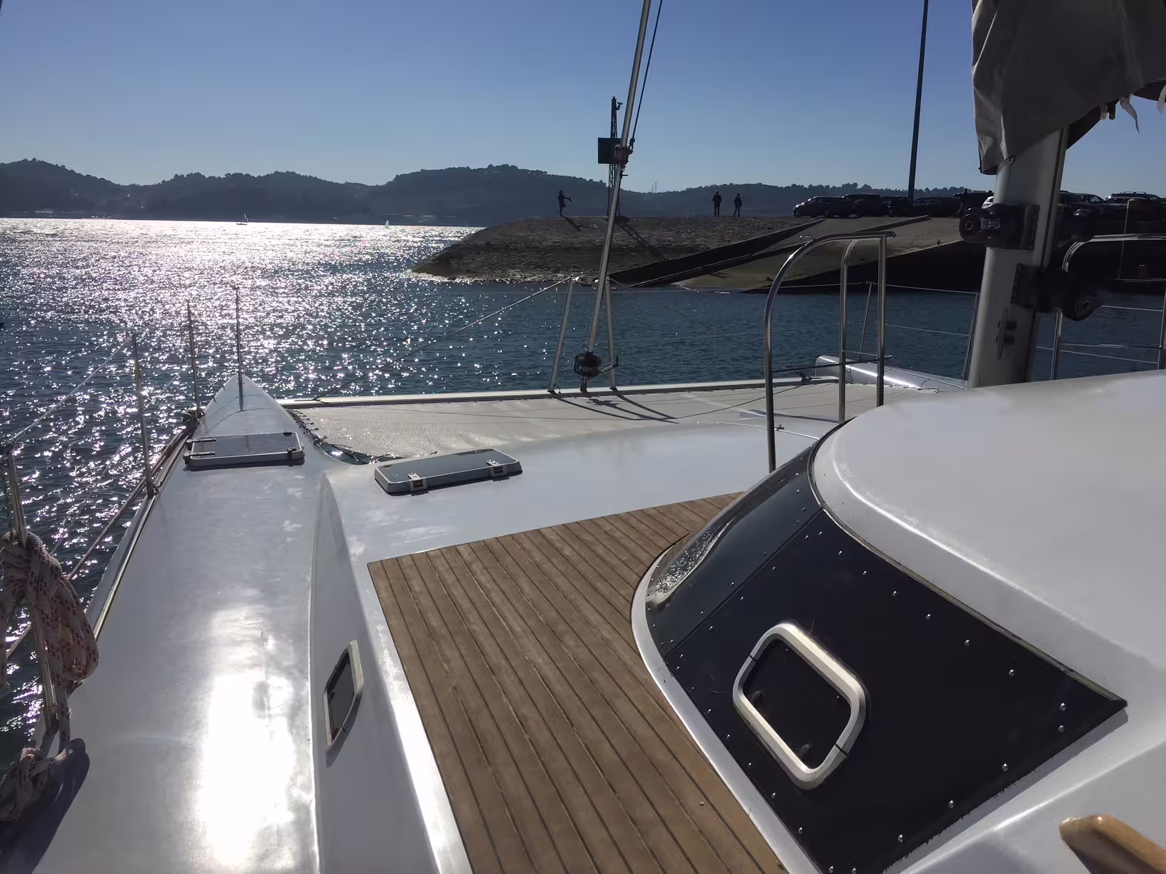 Experience luxury on a private sailing catamaran 'Scarlett' with stunning coastal views, perfect for up to 16 guests.