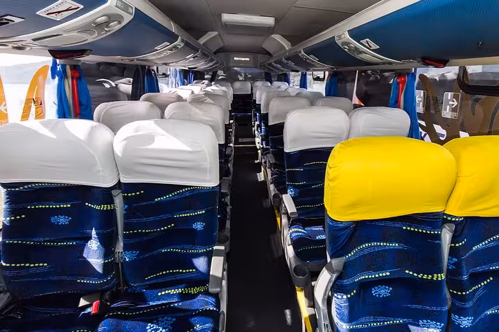 Comfortable and spacious shuttle bus interior with plush seats for Rio de Janeiro to Buzios private transfers.