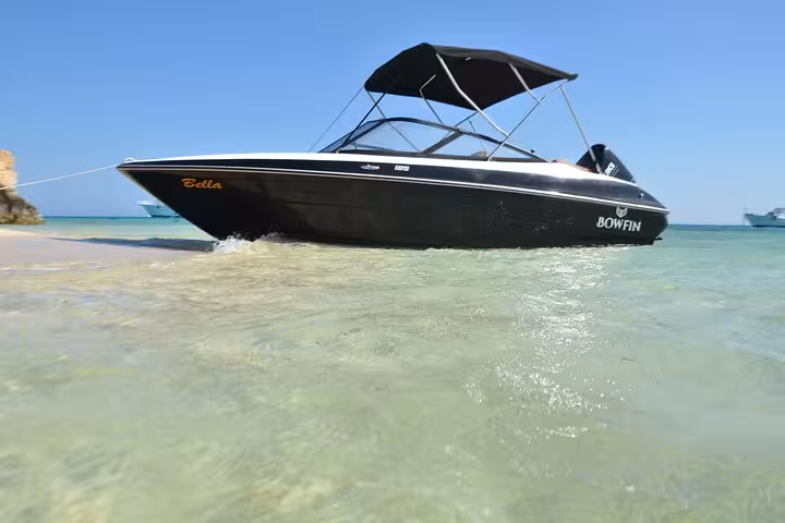 Private speedboat in shallow Red Sea water, Hurghada, ideal for dolphin watching and snorkeling tour