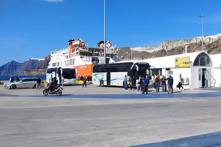 Coaches and travelers at ferry port, premium chauffeur transfer for cruise arrivals, luggage help and fast pickup