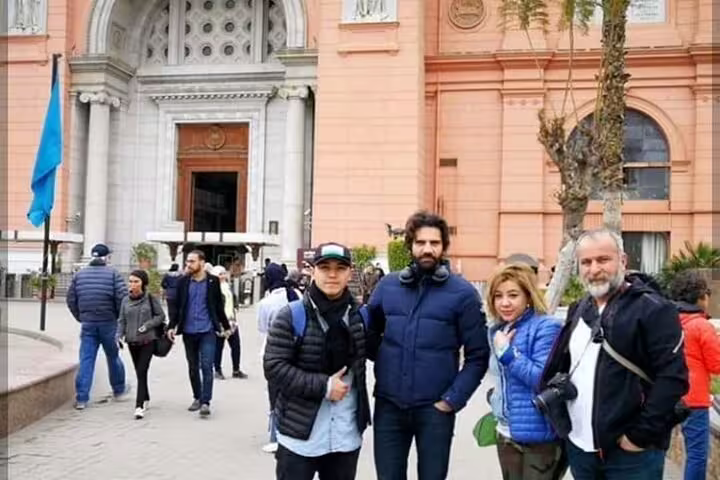 Private tour guests outside Cairo Museum of Egyptian Antiquities, part of NEMC and Giza Pyramids itinerary