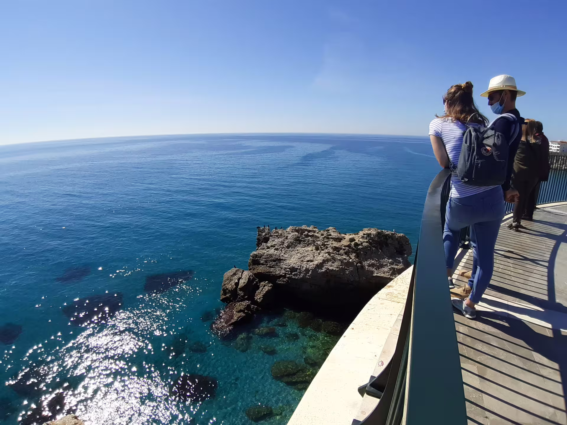 Travelers on the Balcon de Europa in Nerja overlooking the Costa del Sol on a private tour from Malaga