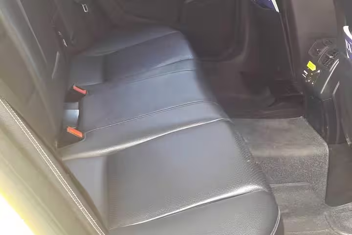 Leather rear-seat interior of private transfer vehicle from Athens to Lygia Lefkada, Greece