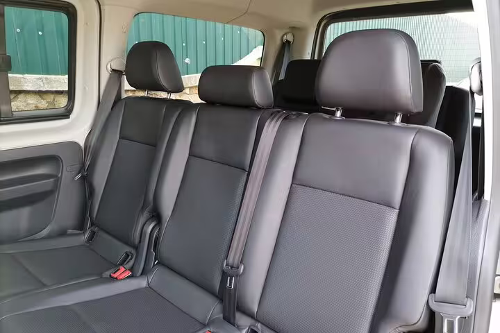 Spacious leather seats in a Volkswagen vehicle, ensuring comfortable private transfer to Faro Albufeira Alvor Seville Lisbon Lagos.