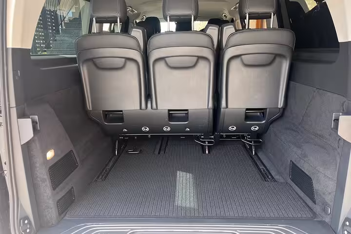 Spacious van interior with ample luggage space for a comfortable private transfer from Milan to Nice.