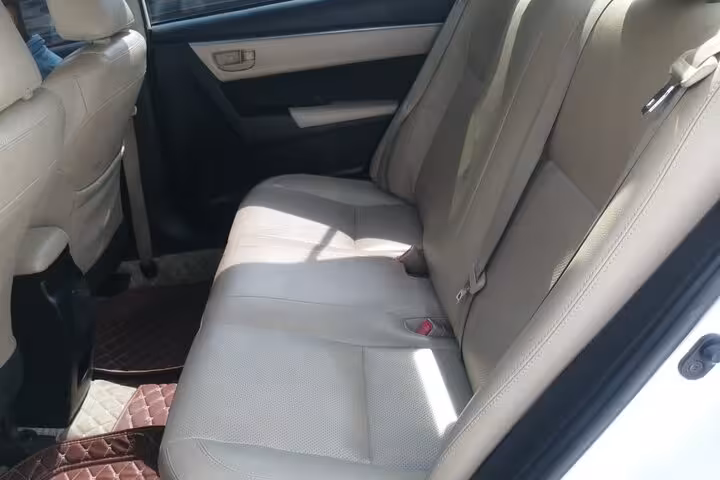 Spacious clean backseat of modern car prepared for comfortable private transfer service from Muscat to Nizwa