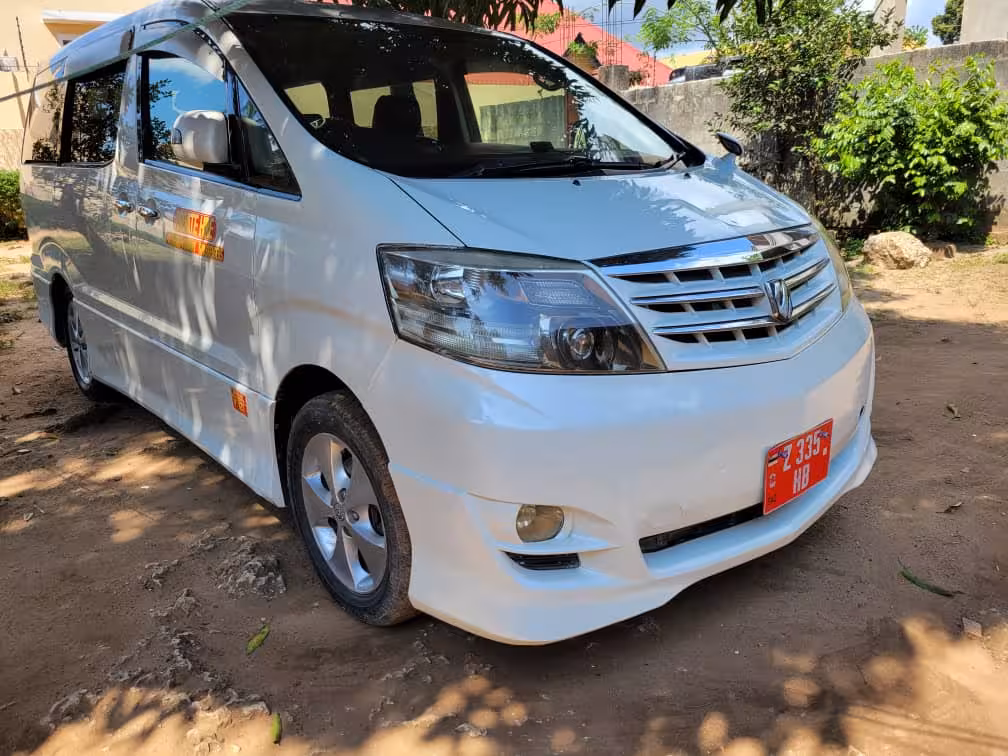 Spacious air-conditioned van ready for private transfer from Pongwe hotels to Zanzibar Airport ZNZ for safe travel.