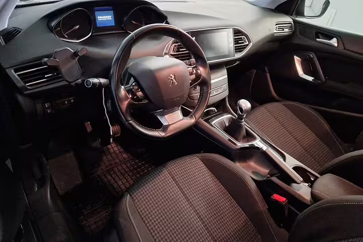 Luxurious interior of a private transfer vehicle for Porto to Lisbon journey, featuring modern amenities and comfort.