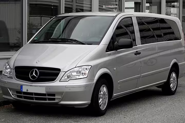 Modern silver Mercedes minivan used for private transfer service between Positano and Naples, ideal for groups and families
