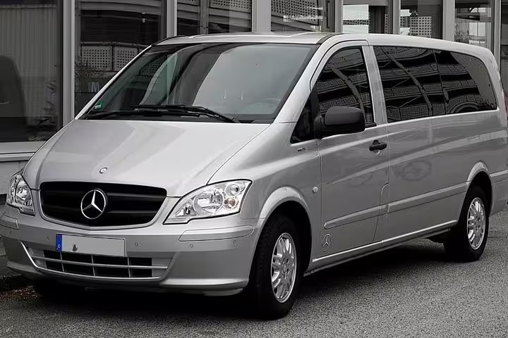 Modern silver Mercedes minivan used for private transfer service from Rome to Amalfi Coast hotels and villas