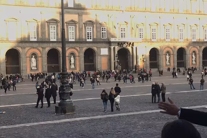 Private transfer from Rome or Fiumicino Airport to Naples Beverello pier, travelers in city square