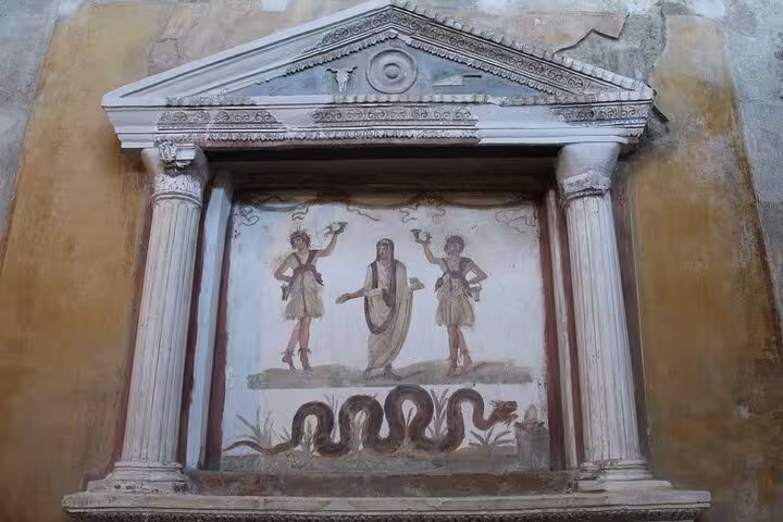 Discover intricate ancient art in Pompeii on a private tour from Rome, featuring detailed frescoes and classical columns.