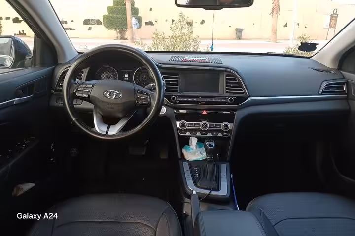 Clean Hyundai sedan interior for private Sharm El Sheikh hotel transfer with air-conditioned comfort and space