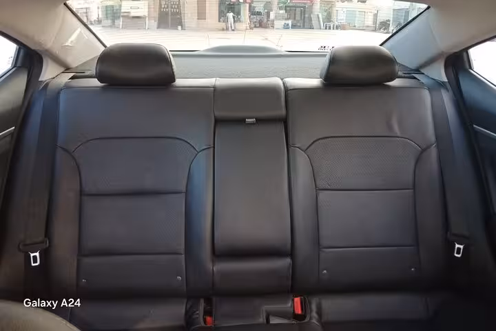 Clean rear seats inside private transfer car in Sharm El Sheikh, comfortable hotel-to-anywhere ride option