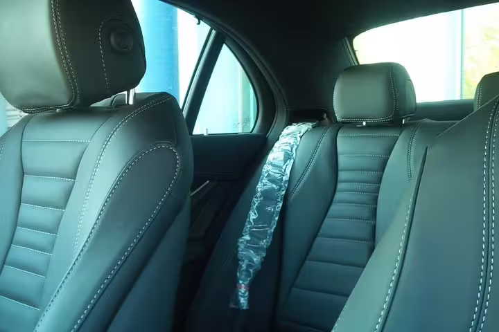 Luxurious black leather seats in a car for private transfer from Venice Marco Polo airport to Piazzale Roma.