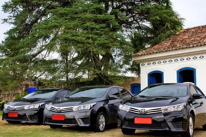 Private transport vehicles ready for scenic journey from Rio de Janeiro to Paraty, offering comfort and convenience.