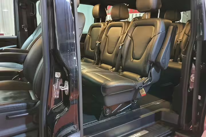 Spacious private van interior for Madrid airport transfer with hotel pickup, comfortable leather seats and room for luggage
