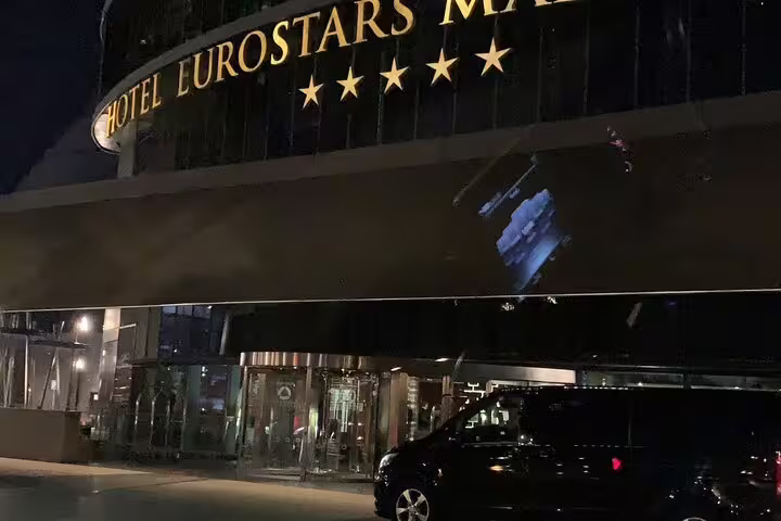 Private van pickup at Eurostars Madrid hotel for Atocha train station transfer with professional driver